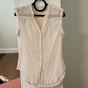 Long cream sleeveless shirt
